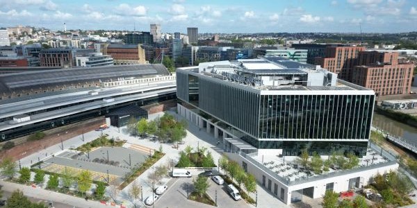 Ariel view over a large modern building, the city of Bristol can been seen in the background.